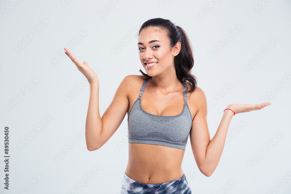 Fitness woman holding copyspace on the palms Fitness woman holding copyspace on the palms