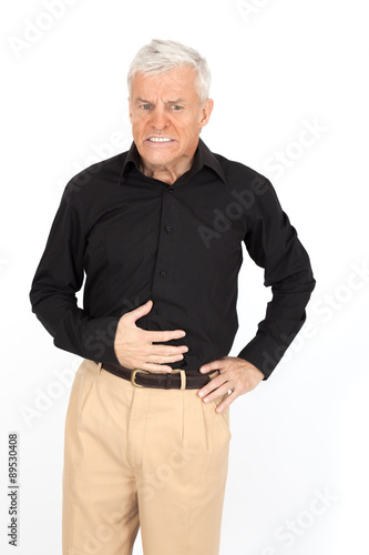 Handsome man doing different expressions in different sets of clothes: stomachache