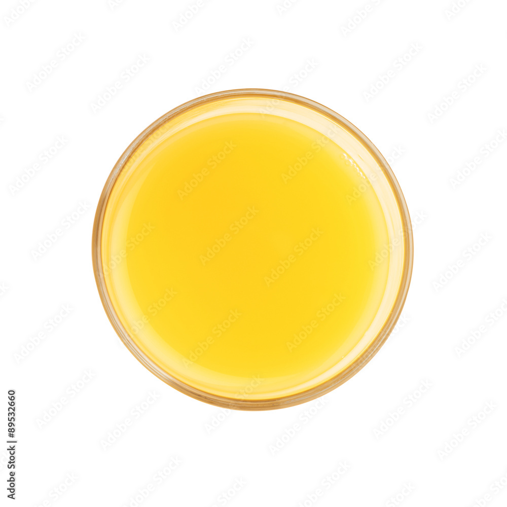 Glass filled with the orange juice isolated over the white