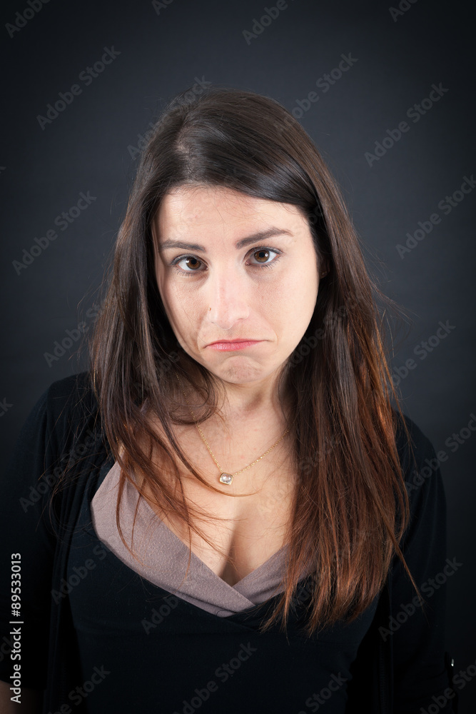 Beautiful woman doing different expressions in different sets of clothes: sad Beautiful woman doing different expressions in different sets of clothes: sad
