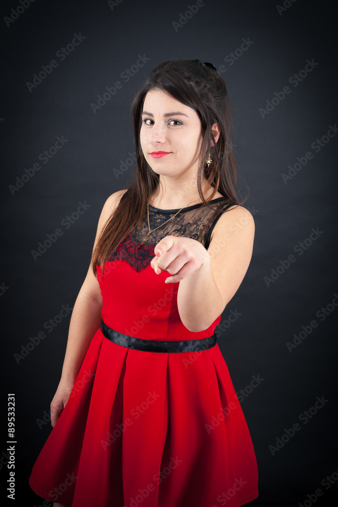 Fototapeta premium Beautiful woman doing different expressions in different sets of clothes: pointing