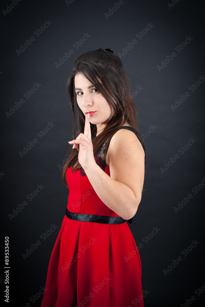 Beautiful woman doing different expressions in different sets of clothes: gun sign Beautiful woman doing different expressions in different sets of clothes: gun sign