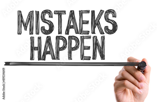 фотографія Hand with marker writing the word Mistaeks Happen