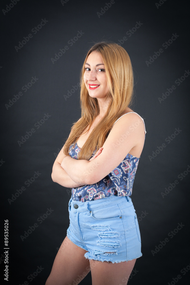 Beautiful girl doing different expressions in different sets of clothes: arms crossed Beautiful girl doing different expressions in different sets of clothes: arms crossed
