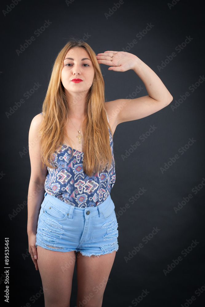 Beautiful girl doing different expressions in different sets of clothes: at attention Beautiful girl doing different expressions in different sets of clothes: at attention