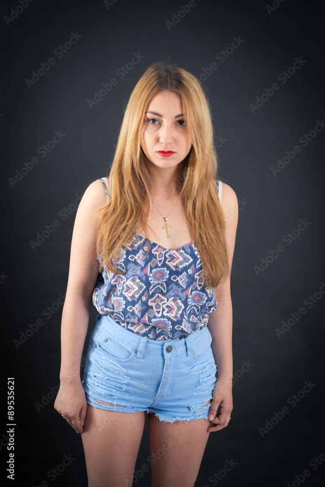 Beautiful girl doing different expressions in different sets of clothes: angry Beautiful girl doing different expressions in different sets of clothes: angry