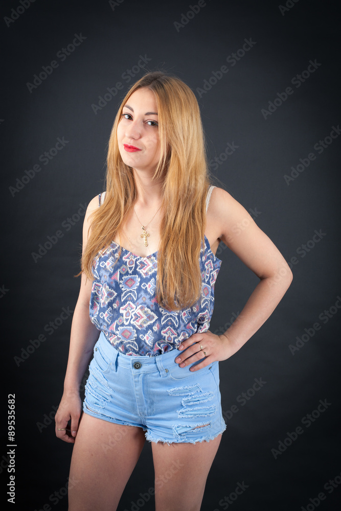 Beautiful girl doing different expressions in different sets of clothes: love Beautiful girl doing different expressions in different sets of clothes: love
