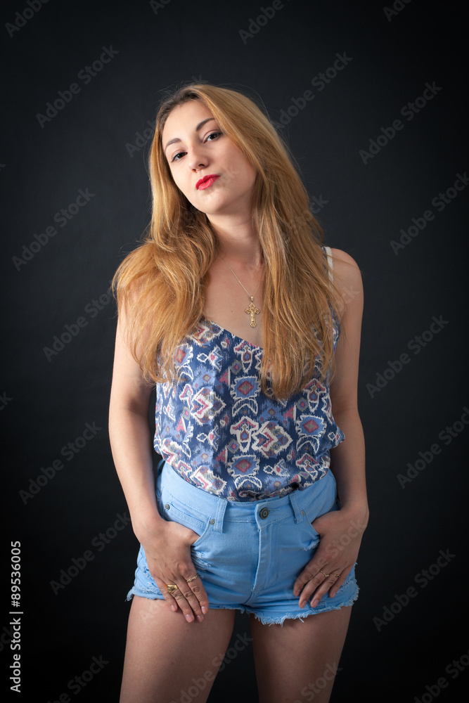 Beautiful girl doing different expressions in different sets of clothes: hands in pockets Beautiful girl doing different expressions in different sets of clothes: hands in pockets