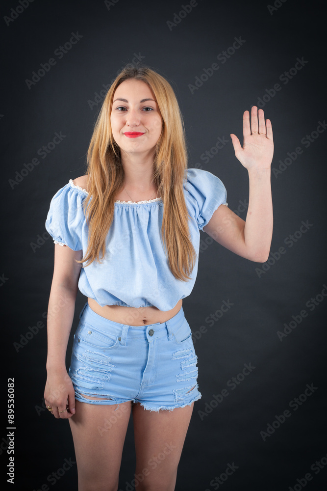 Beautiful girl doing different expressions in different sets of clothes: waving Beautiful girl doing different expressions in different sets of clothes: waving