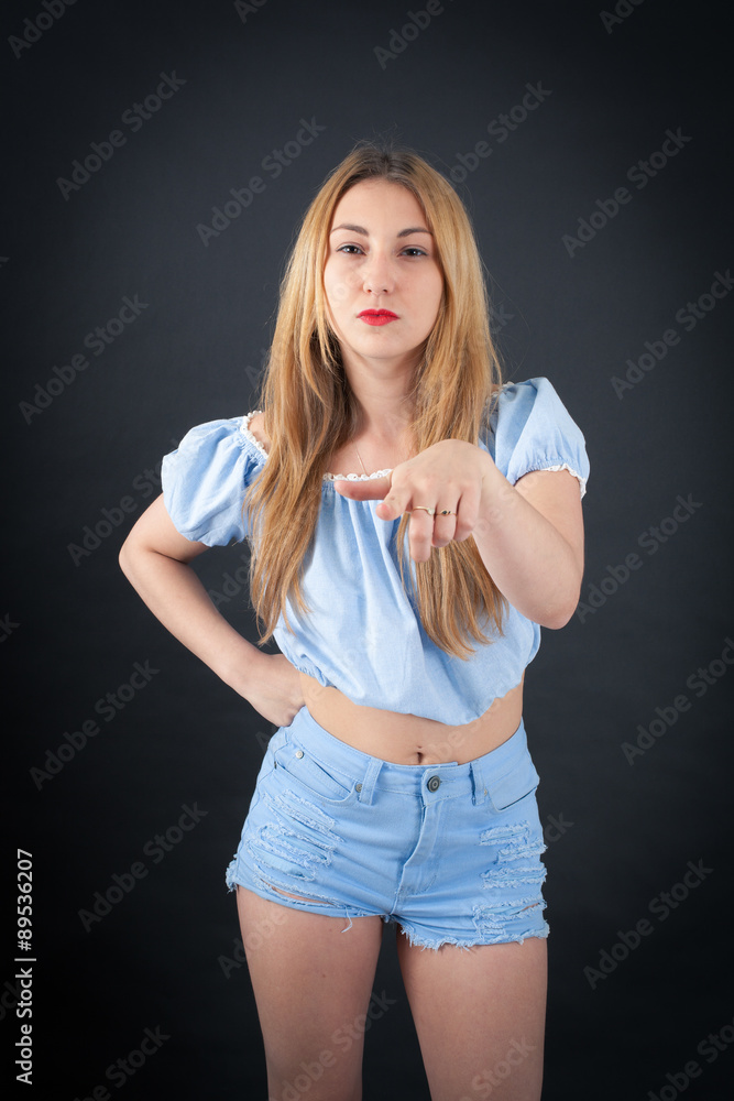 Beautiful girl doing different expressions in different sets of clothes: pointing Beautiful girl doing different expressions in different sets of clothes: pointing