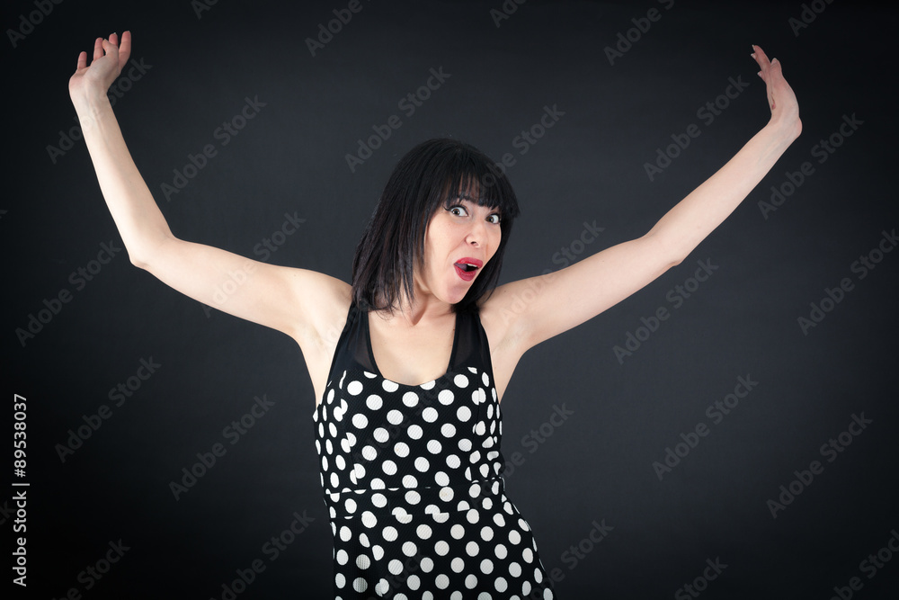 Beautiful woman doing different expressions in different sets of clothes: arms raised Beautiful woman doing different expressions in different sets of clothes: arms raised