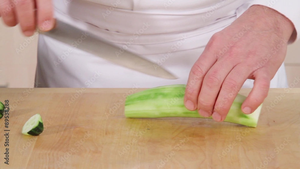 Halving and deseeding a peeled cucumber Halving and deseeding a peeled cucumber