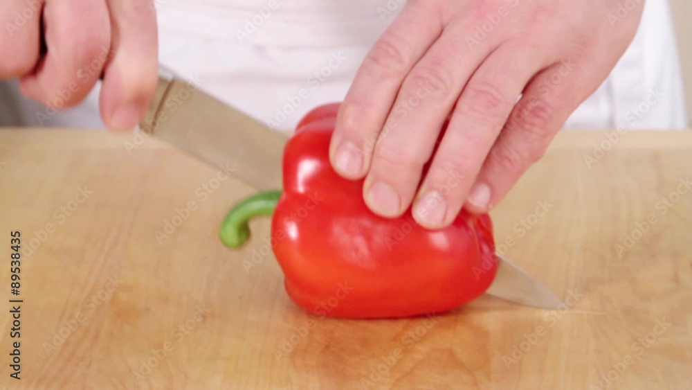 Halving and deseeding a red pepper Halving and deseeding a red pepper