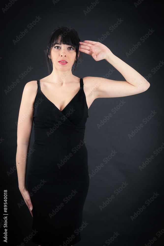 Beautiful woman doing different expressions in different sets of clothes: at attention Beautiful woman doing different expressions in different sets of clothes: at attention