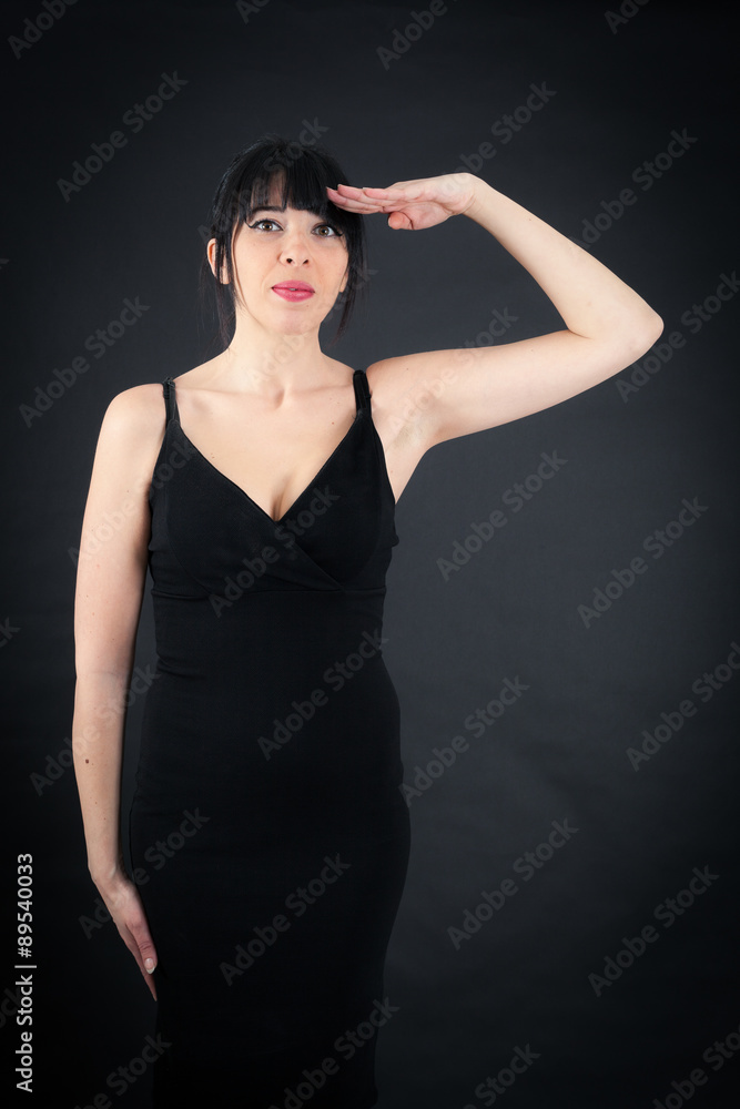 Beautiful woman doing different expressions in different sets of clothes: at attention Beautiful woman doing different expressions in different sets of clothes: at attention