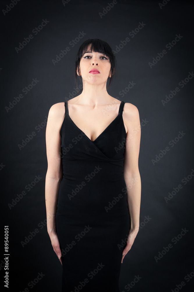 Beautiful woman doing different expressions in different sets of clothes: at attention Beautiful woman doing different expressions in different sets of clothes: at attention