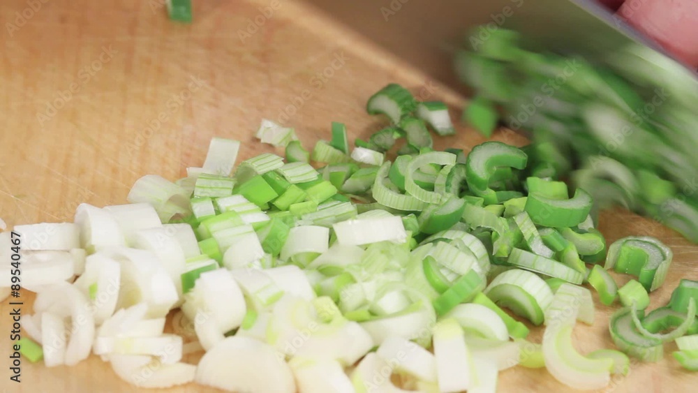 Spring onions being chopped Spring onions being chopped