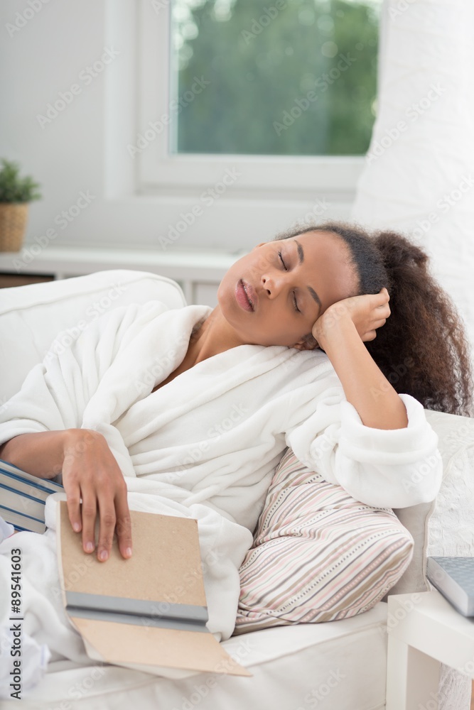 Woman falling asleep while reading Woman falling asleep while reading
