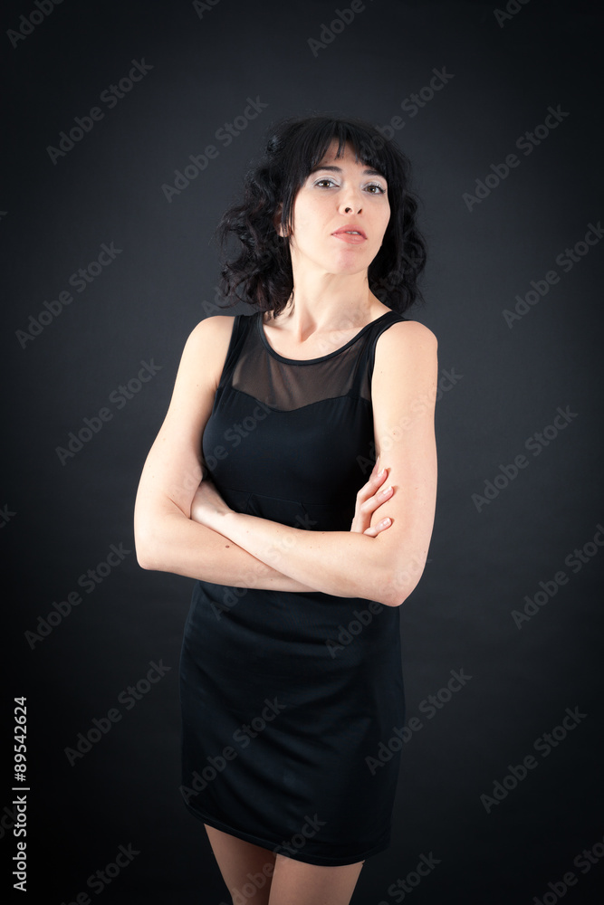Beautiful woman doing different expressions in different sets of clothes: arms crossed Beautiful woman doing different expressions in different sets of clothes: arms crossed