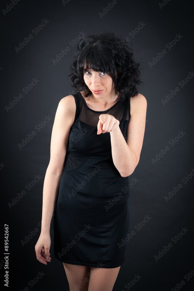 Beautiful woman doing different expressions in different sets of clothes: pointing Beautiful woman doing different expressions in different sets of clothes: pointing
