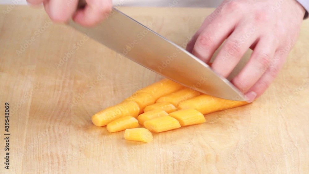 Carrots being chopped Carrots being chopped