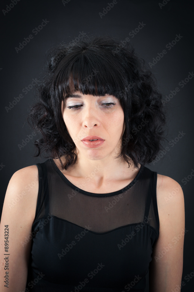 Beautiful woman doing different expressions in different sets of clothes: sad Beautiful woman doing different expressions in different sets of clothes: sad