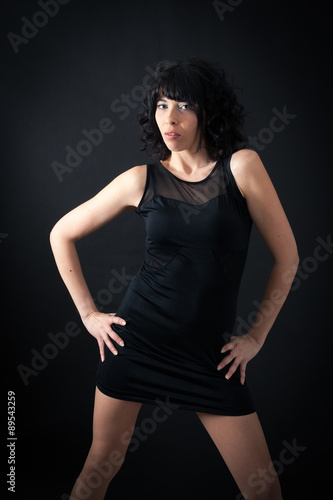 Beautiful woman doing different expressions in different sets of clothes: posing