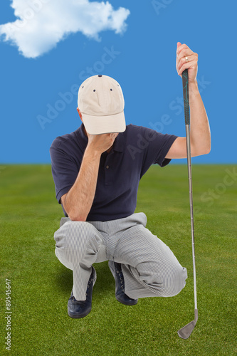 Disappointed golfer on the green