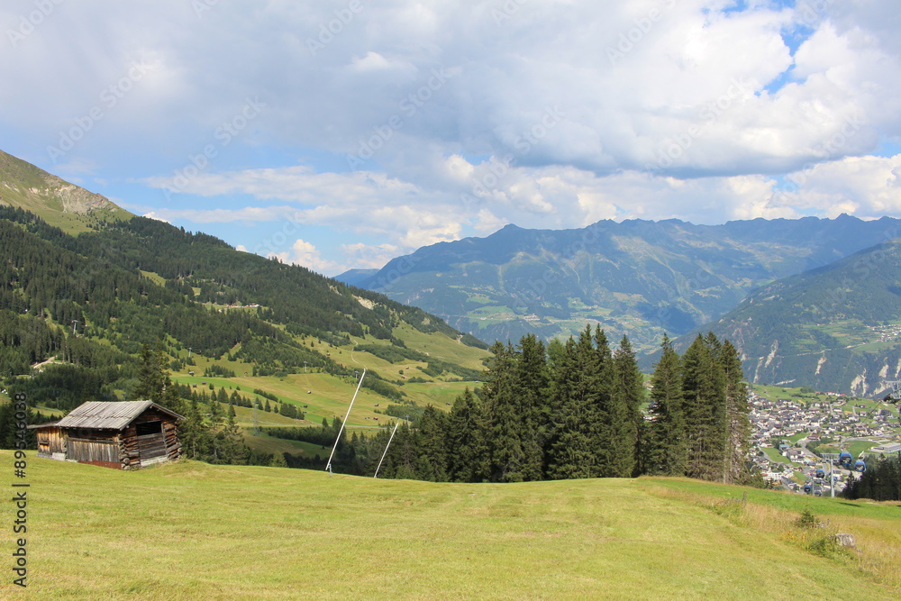 A wooden ski hut on Alp mountains with green meadow in Fiss, Tirol, Austria. 