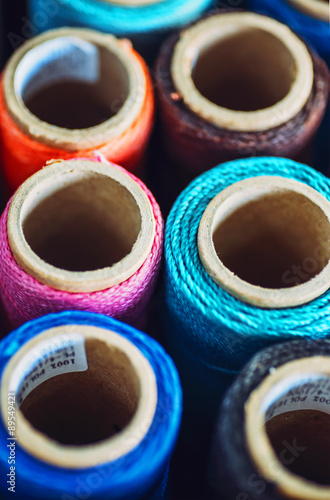 Sewing threads multicolored background closeup texture