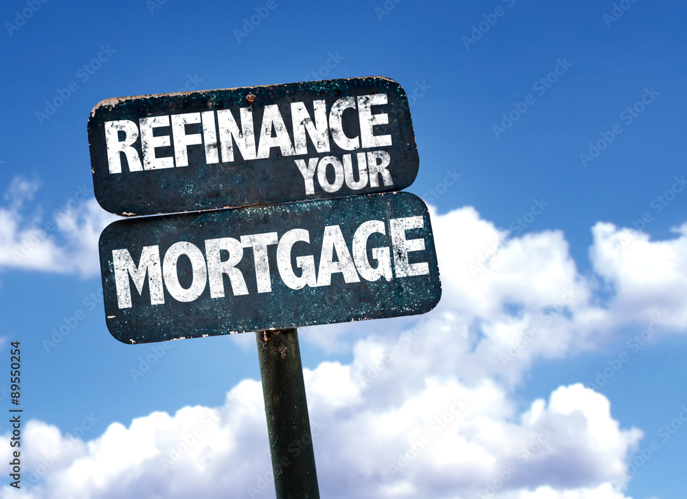 Refinance Your Mortgage sign with sky background Refinance Your Mortgage sign with sky background