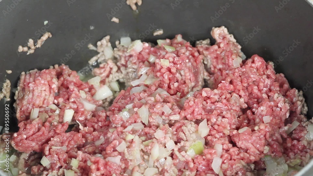 Onions and minced meat being fry Onions and minced meat being fry