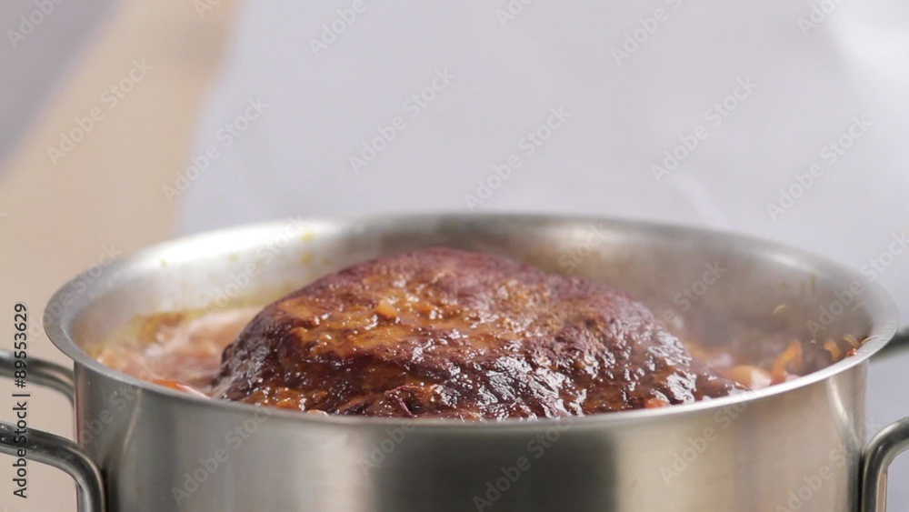 Adding a bay leaf to braised beef Adding a bay leaf to braised beef