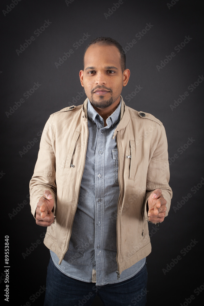Handsome man doing different expressions in different sets of clothes: gun sign Handsome man doing different expressions in different sets of clothes: gun sign