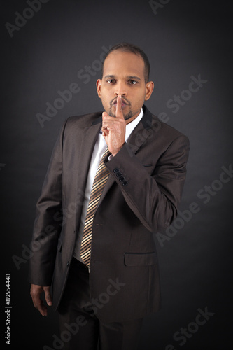 Handsome man doing different expressions in different sets of clothes: be quiet