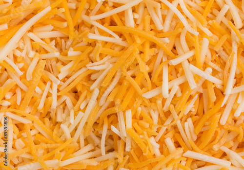 Close view of shredded cheeses
