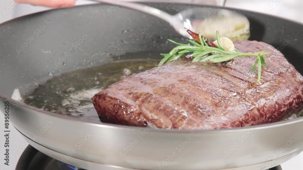 Sealing venison saddle fillet in a pan Sealing venison saddle fillet in a pan