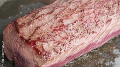 Sealing venison saddle fillet in a pan