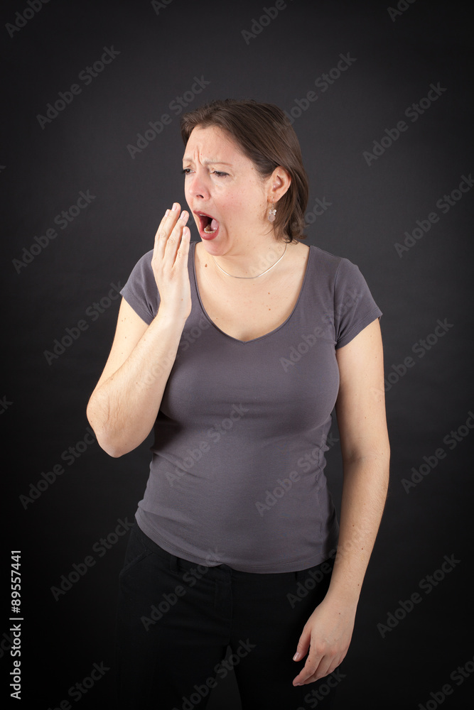 Beautiful woman doing different expressions in different sets of clothes: yawn Beautiful woman doing different expressions in different sets of clothes: yawn