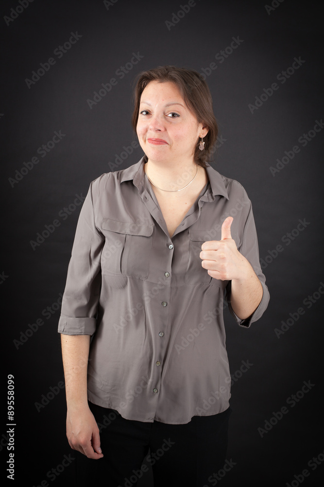 Beautiful woman doing different expressions in different sets of clothes: thumbs up Beautiful woman doing different expressions in different sets of clothes: thumbs up