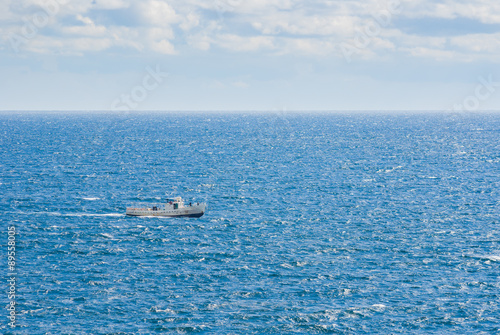 Boundless blue sea and lonely ship © Yuri Kravchenko