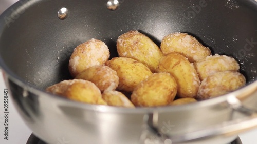 Cooked potatoes with a salt crust in a pot