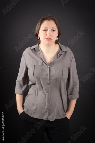 Beautiful woman doing different expressions in different sets of clothes: bored