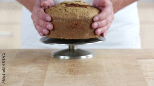 Carrot cake being sliced twice horizontally photo