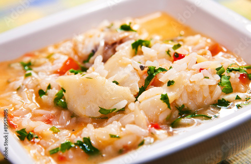 Authentic portuguese food: Delicious soup-like rice with codfish