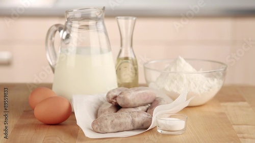 Ingredients for toad in the hole (sausages in batter, England) photo