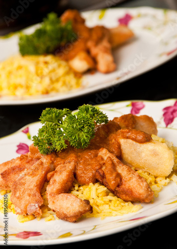 Crispy fish "fingers" with curry sauce and rice