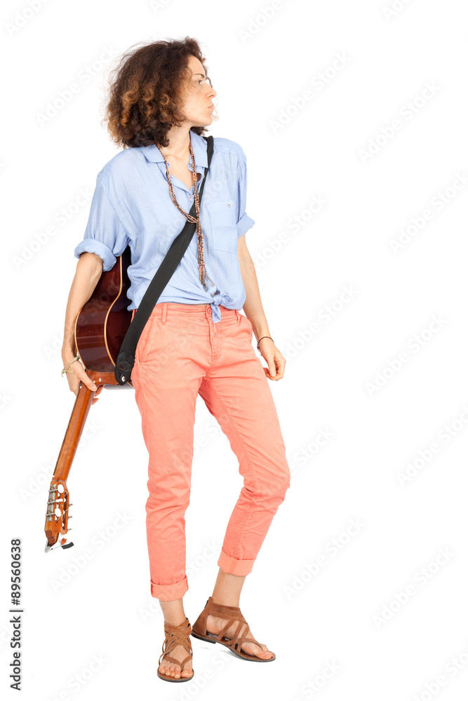 Beautiful woman doing different expressions in different sets of clothes: posing with guitar Beautiful woman doing different expressions in different sets of clothes: posing with guitar