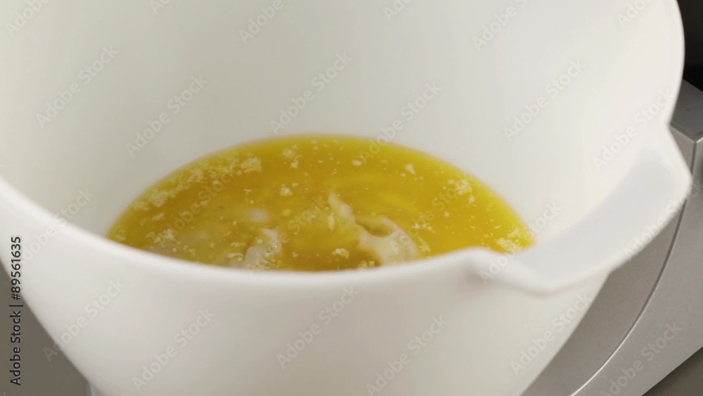 Cake mixture ingredients being added to mashed bananas Cake mixture ingredients being added to mashed bananas