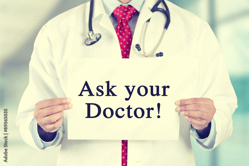doctor hands holding card sign with Ask your Doctor text message doctor hands holding card sign with Ask your Doctor text message